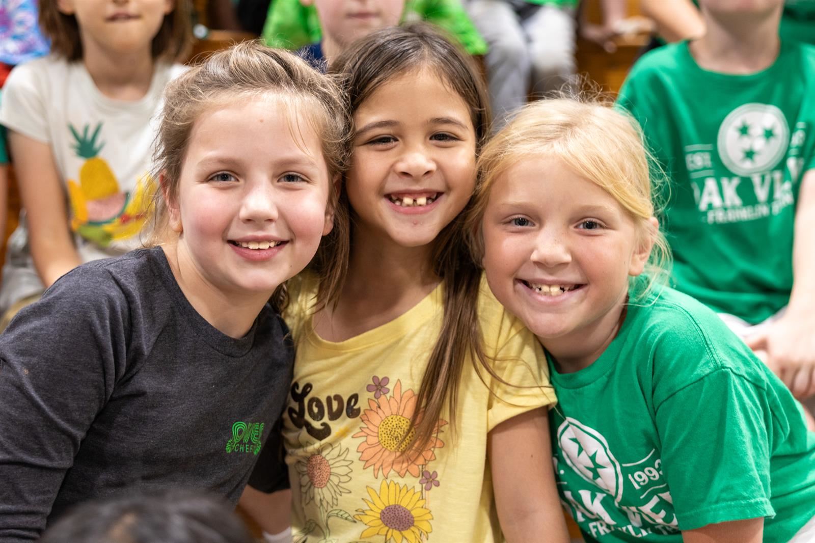 three girls smiling